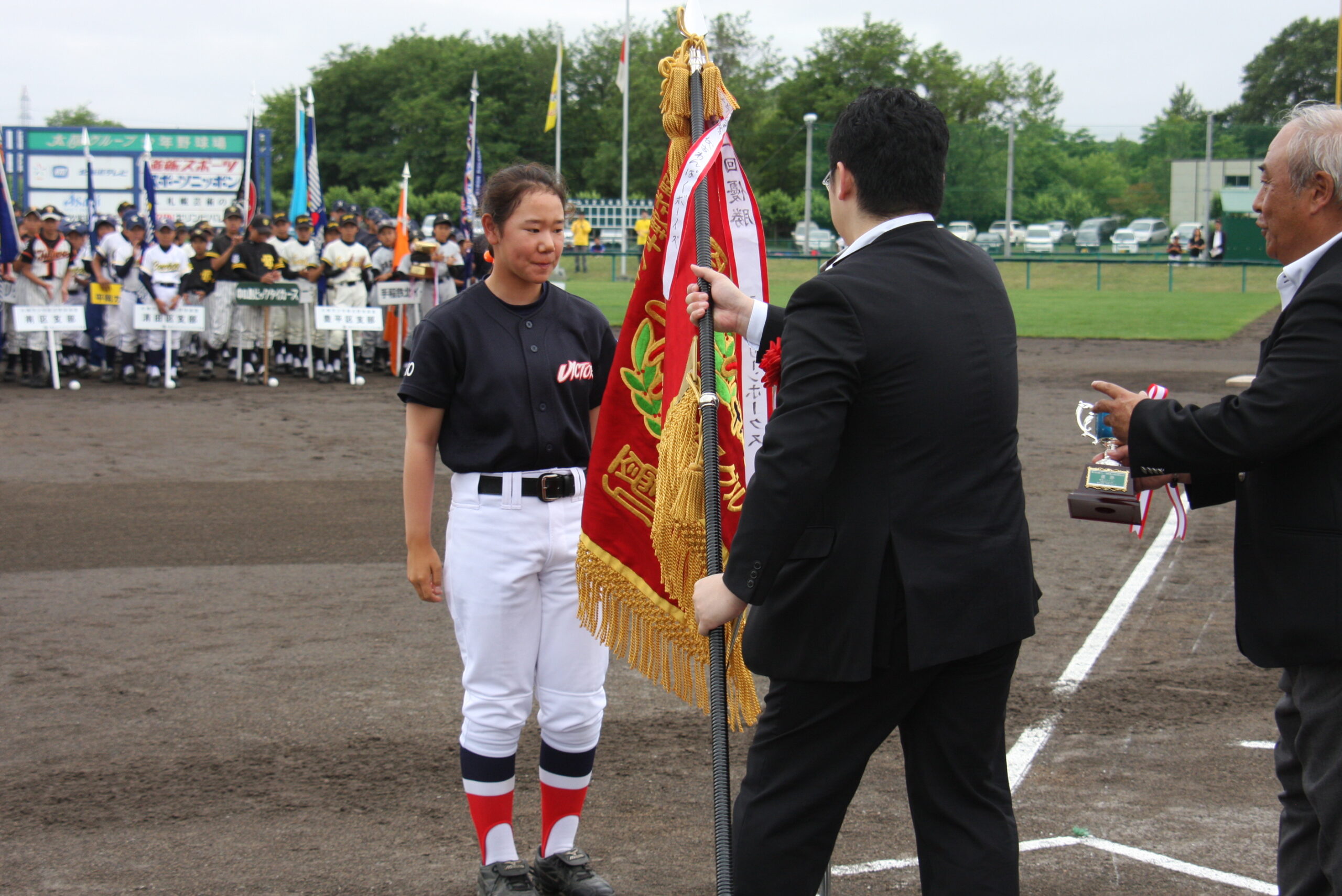 優勝旗返還